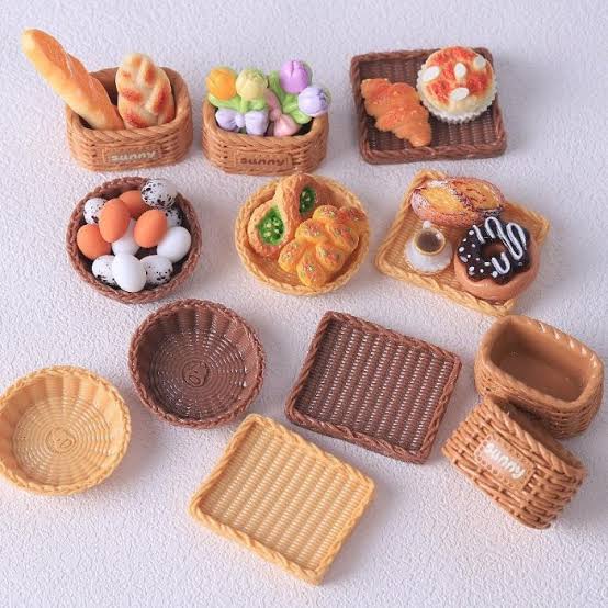 Clay miniature food charms shaped like bread and pastries made by kids