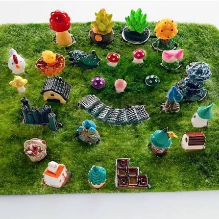 Miniature garden scene with tiny mushrooms paths and houses