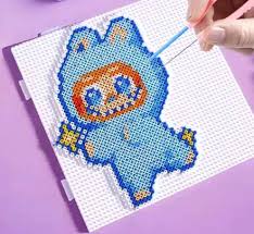 Mini perler bead pixel art being built on a pegboard with tweezers