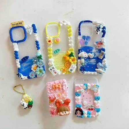 Phone cases decorated with whipped cream glue and deco parts by kids