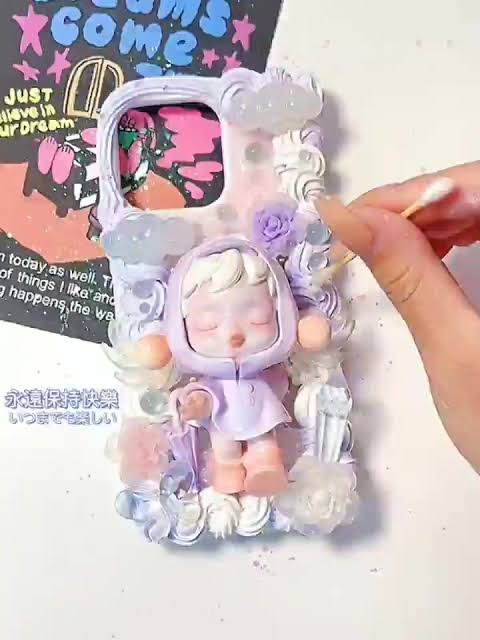 Whipped cream glue phone case decorated with a doll and deco parts